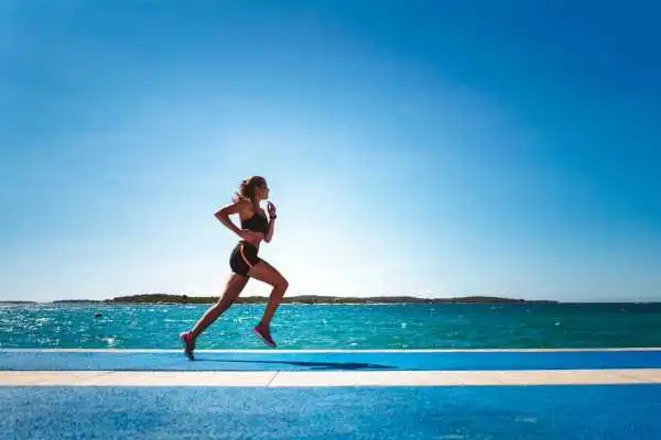 Woman running showing strong leg muscle Sale